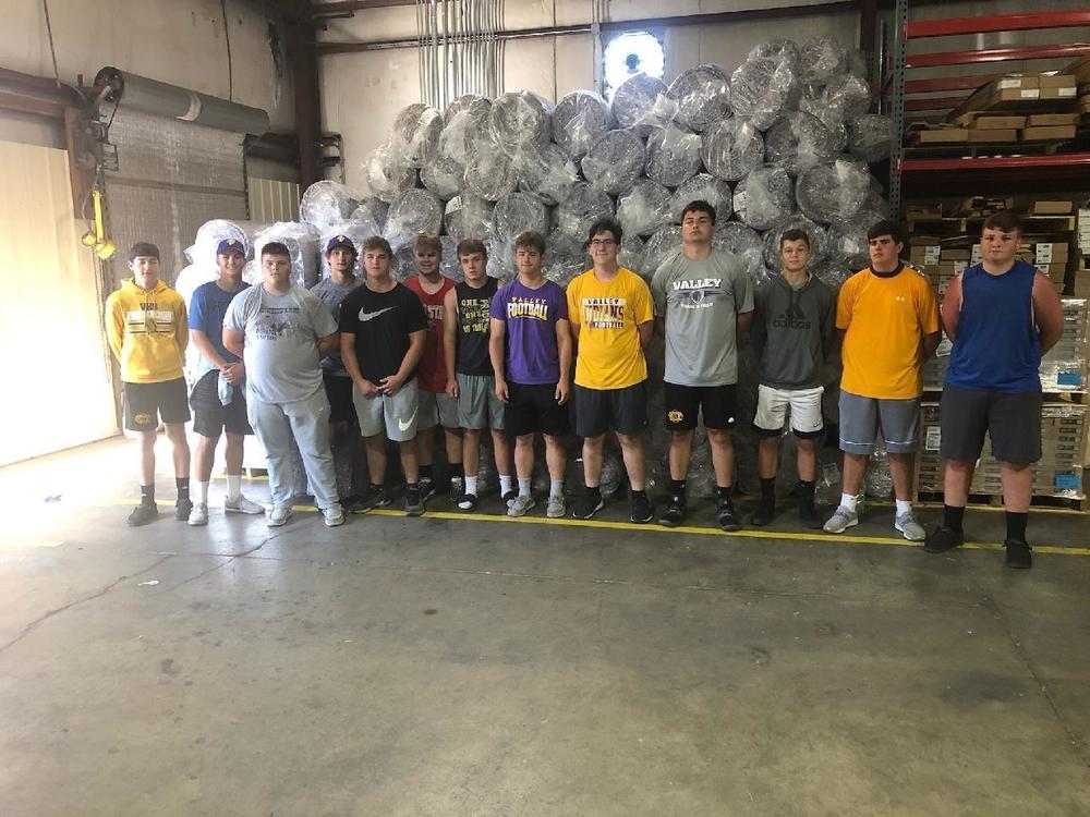 Football Team Volunteers with Community Service